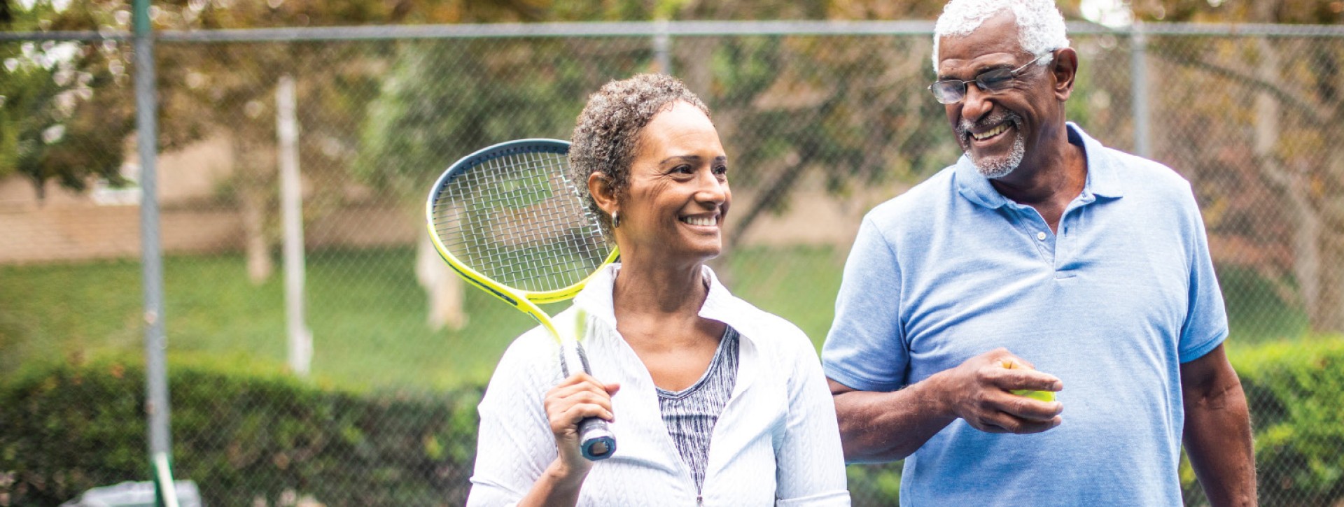 Couple playing tennis